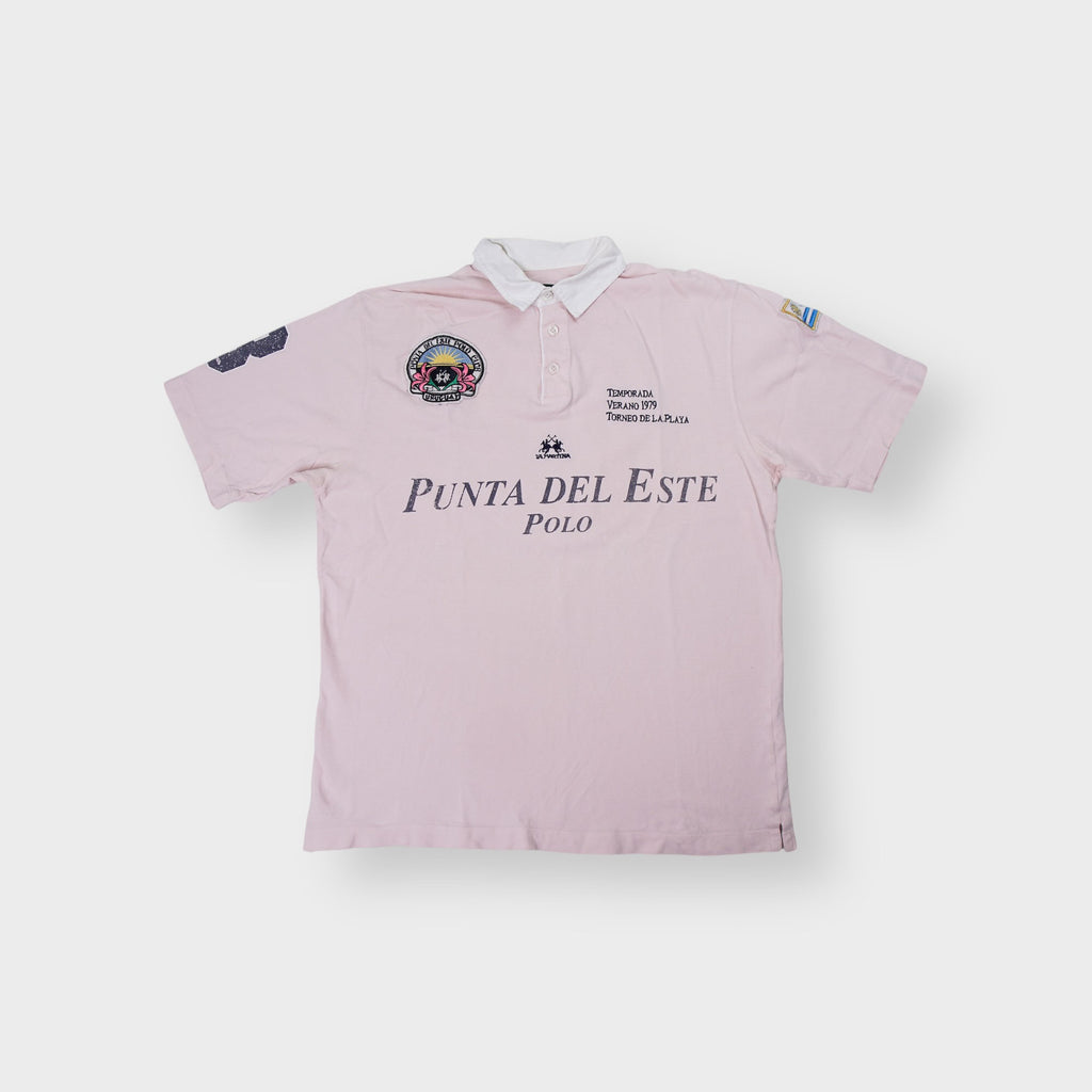 La Martina polo shirt in pink with Punta Del Este Polo chest embroidery.