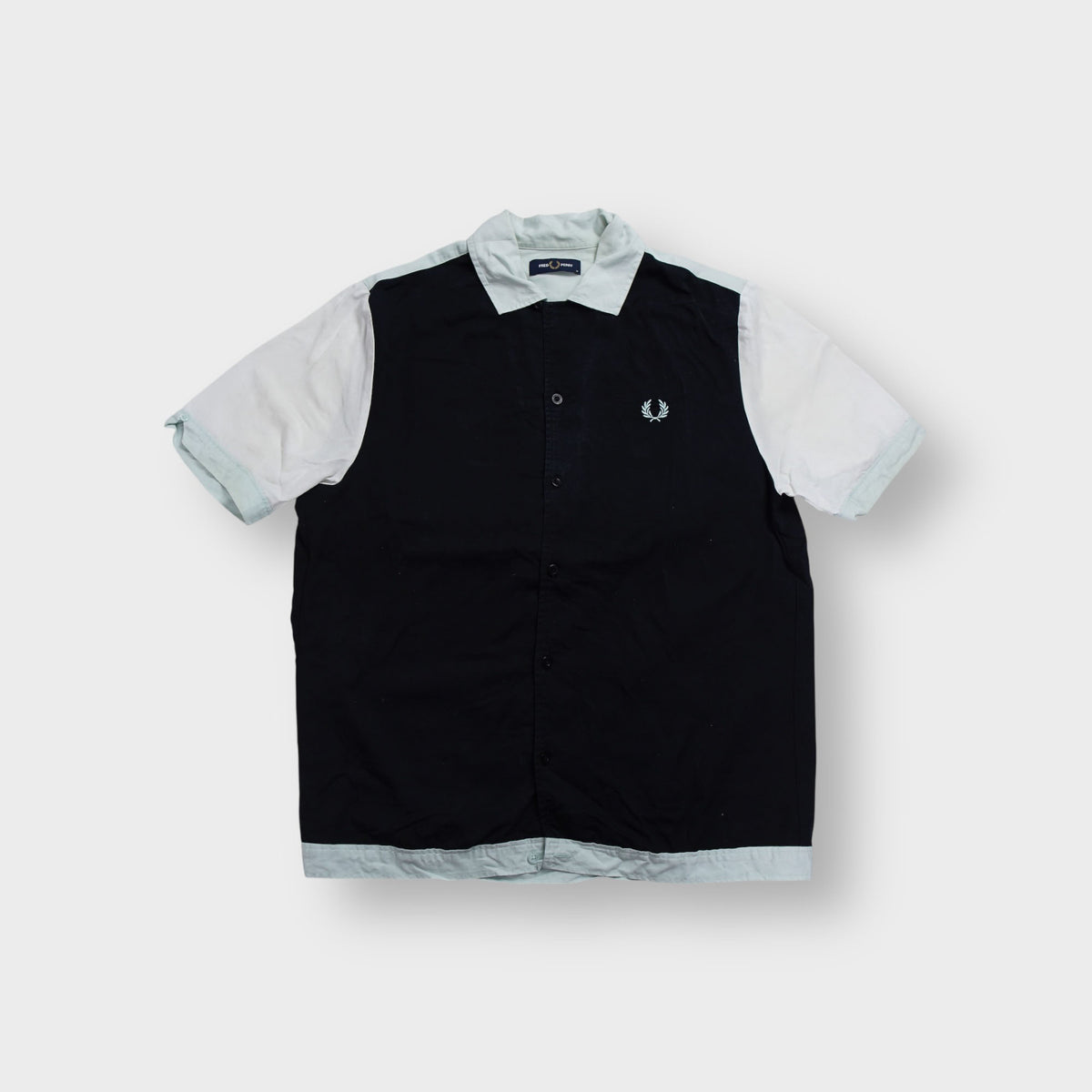 Fred Perry black and white button-up shirt with an embroidered chest logo