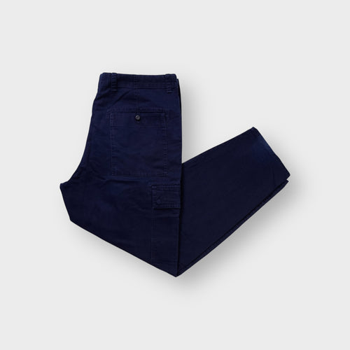 Lacoste cargo pants in navy blue featuring flap thigh pockets and button back pockets.
