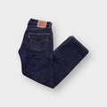 Levi's 501 jeans in dark indigo denim with signature leather patch on waist