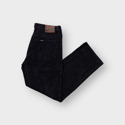 Lee black denim jeans featuring a brown leather patch on the back waistband
