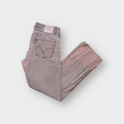 Levi's brown and white corduroy jeans with signature arcuate stitching on back pocket