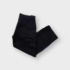 Black Nike cargo trousers featuring flap utility pockets on both side legs