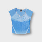 Nike shirt in blue with light blue gradient lines and embroidered swoosh logo