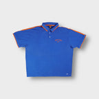 Nike polo shirt in blue featuring orange Boise State embroidery and collar trim.