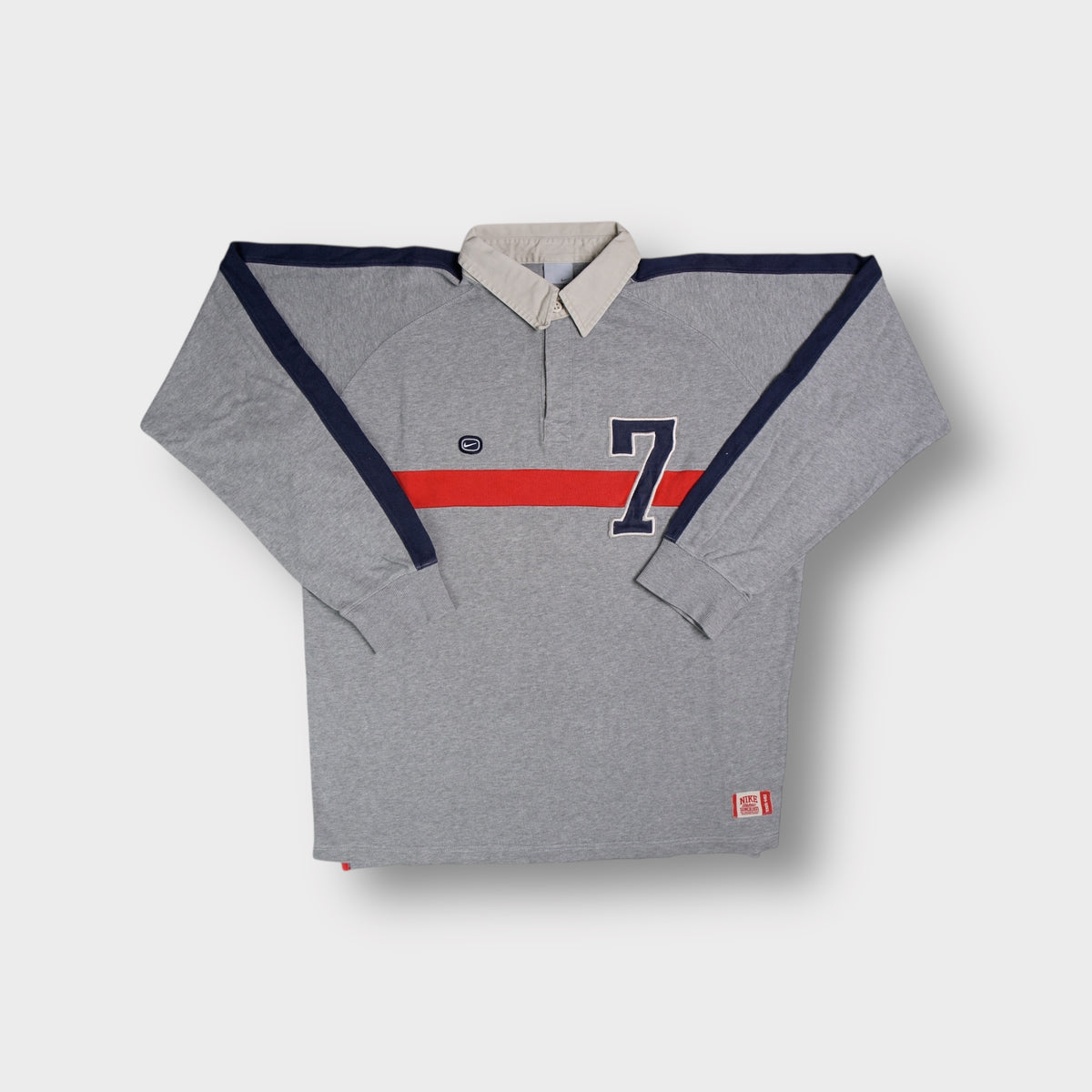 Nike grey long-sleeve polo sweater with a beige collar and a large number 7 patch