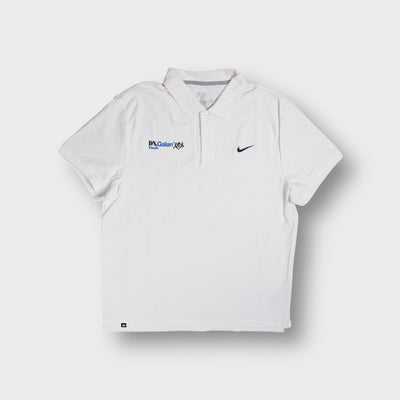 White Nike polo shirt with DN.Galan Youth embroidery and small black swoosh logo.