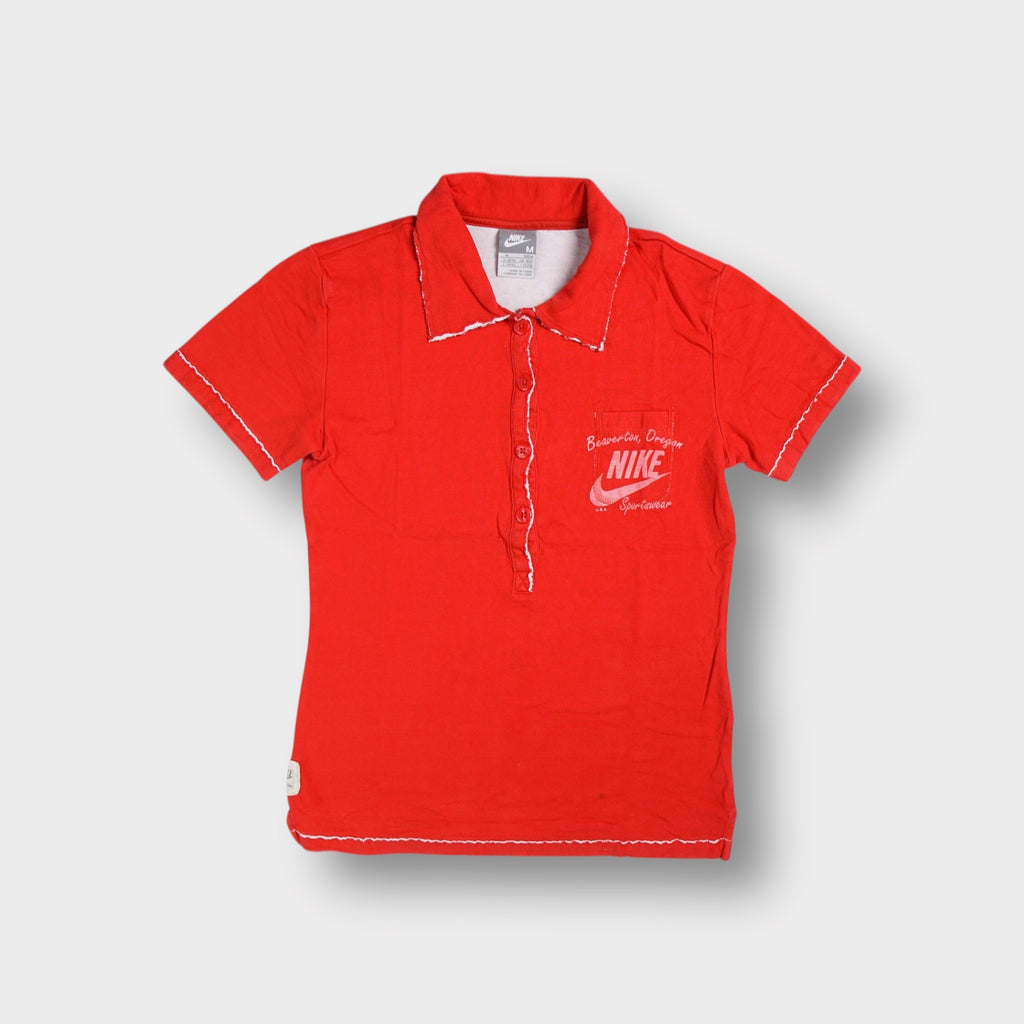 Nike polo shirt in red with white contrast raw edge trim and a chest pocket logo