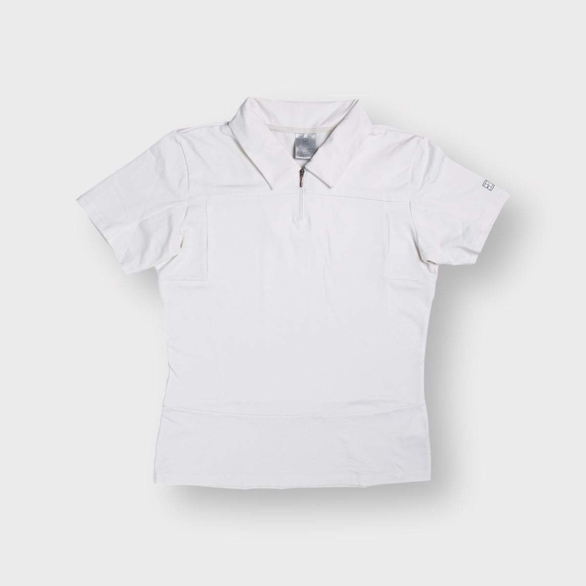 Nike tennis polo shirt in white featuring a half-zip neckline and collar