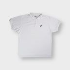 Nike polo shirt in white featuring a small black embroidered swoosh logo on chest