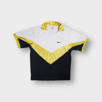 Nike shirt in white and yellow featuring a chevron pattern and small chest swoosh