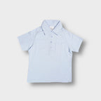 Baby blue Nike Golf polo shirt with a chest pocket and buttoned collar