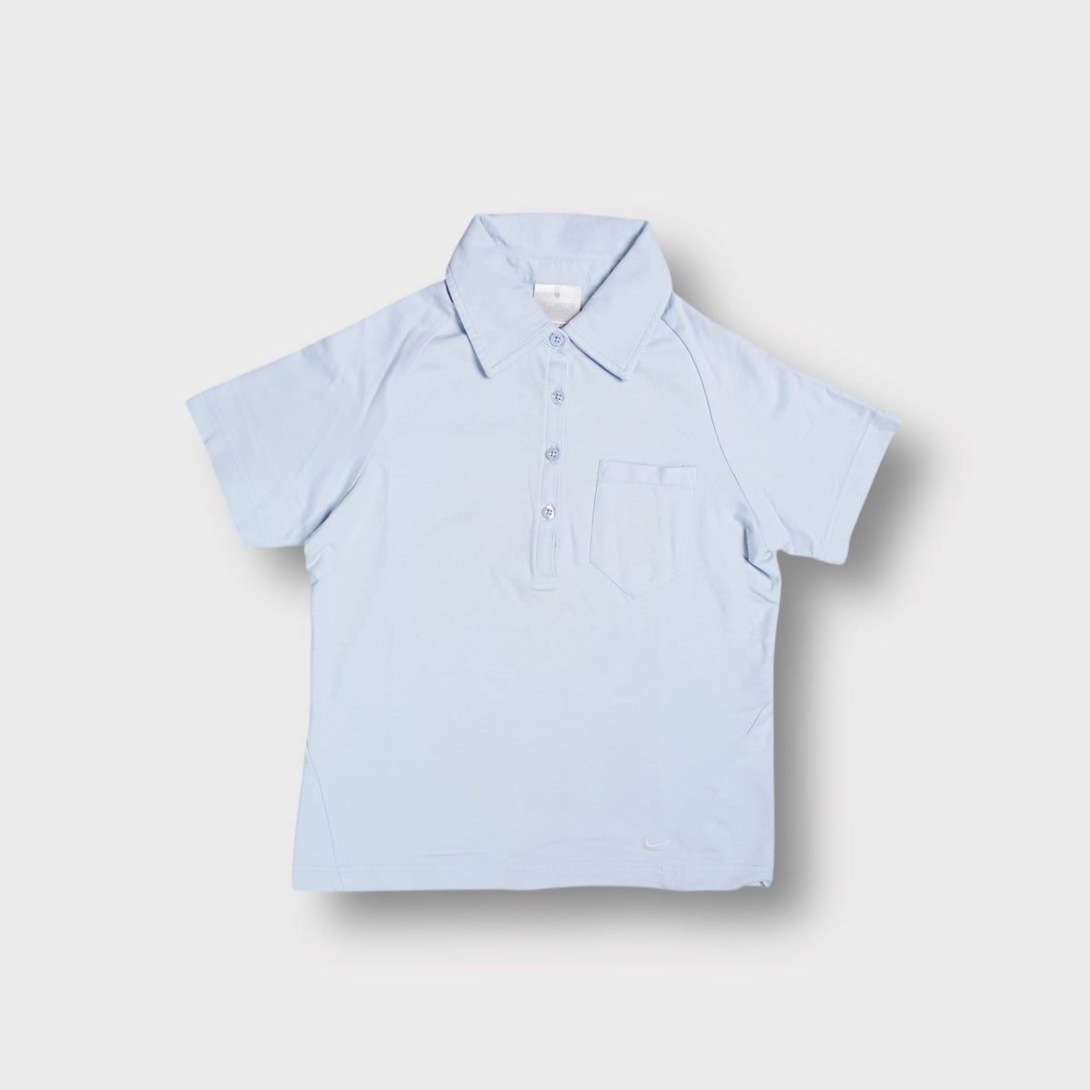 Baby blue Nike Golf polo shirt with a chest pocket and buttoned collar