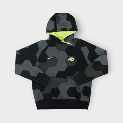 Nike grey pullover hoodie featuring a geometric pattern and neon yellow hood lining