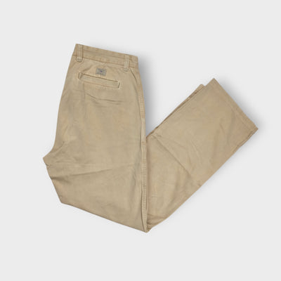 Gant beige chino trousers featuring a small woven logo patch above the back pocket