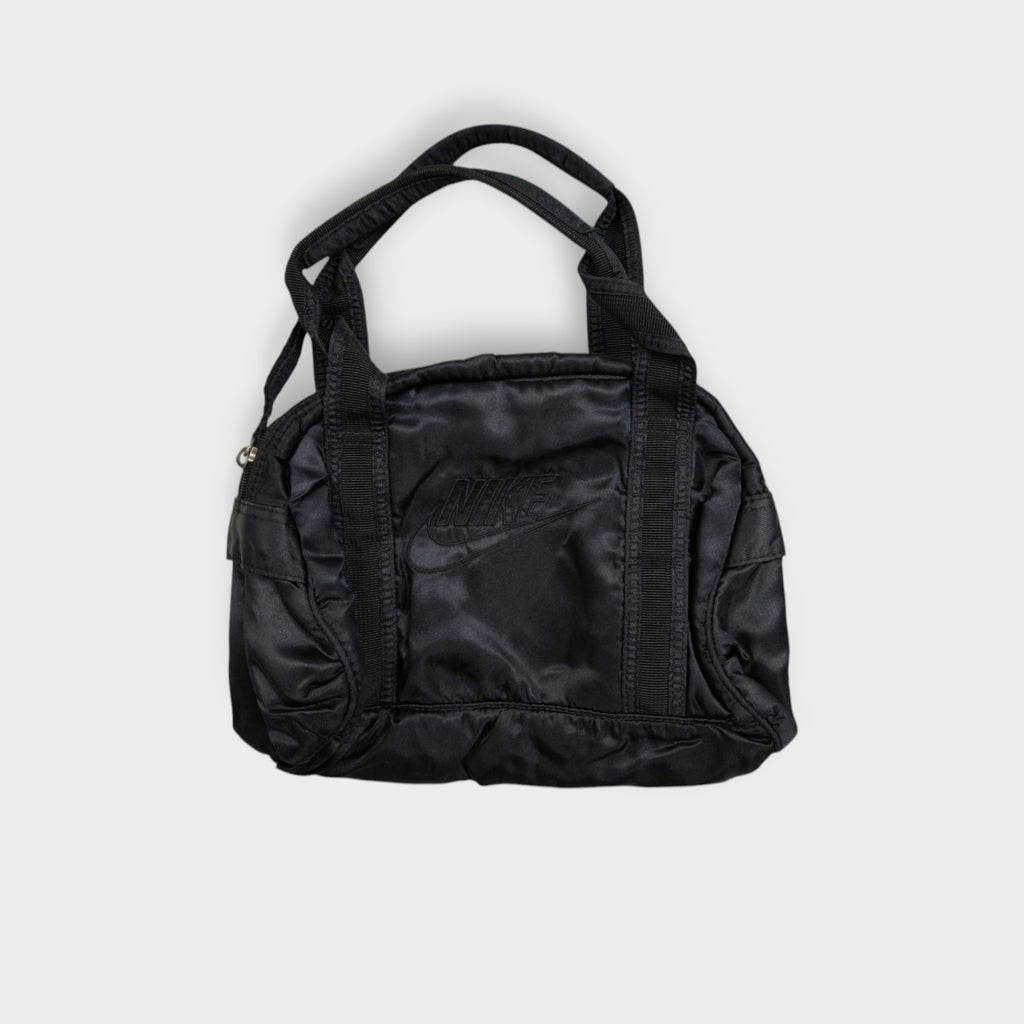 Nike handbag in black featuring an embroidered logo on the front panel and top handles.