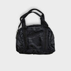Nike handbag in black featuring an embroidered logo on the front panel and top handles.