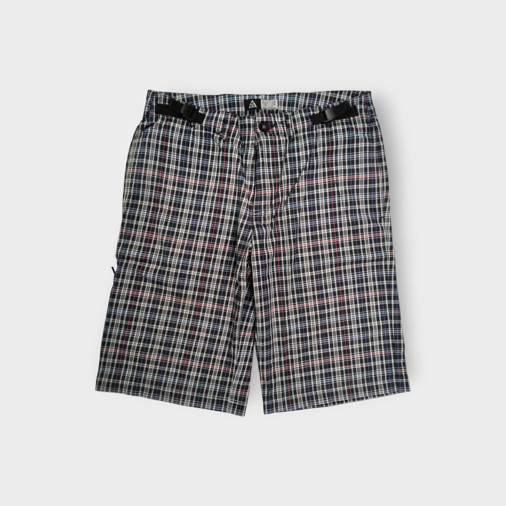 Nike ACG plaid shorts in white and dark pattern with integrated waist straps