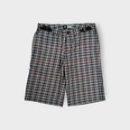 Nike ACG plaid shorts in white and dark pattern with integrated waist straps