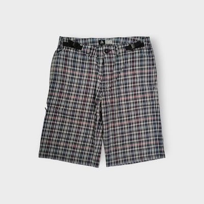 Nike ACG plaid shorts in white and dark pattern with integrated waist straps