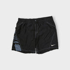 Nike black shorts featuring a graphic side design and small white swoosh logo