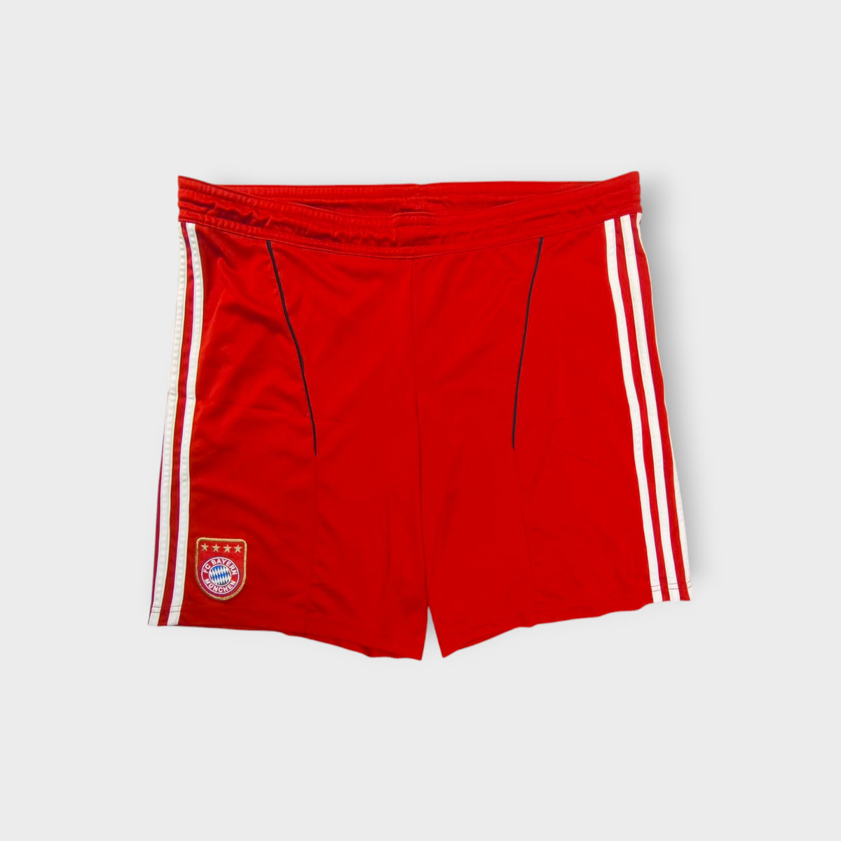 Red Adidas FC Bayern shorts with white stripes and an embroidered team crest