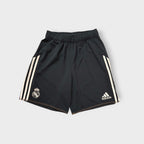 Adidas Real Madrid black sports shorts featuring three white stripes and club crest