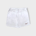 Nike white sports shorts with a swoosh logo on the leg and elastic drawstring waist