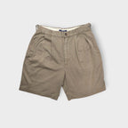 Ralph Lauren chino shorts in beige with front pleats and a Chaps back pocket patch.