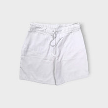 Load image into Gallery viewer, White Nike shorts featuring a small embroidered swoosh logo and front drawstring