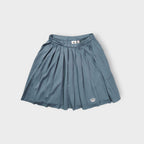 Adidas grey pleated skirt featuring an embroidered Trefoil logo near the hem