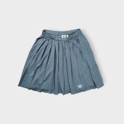 Adidas grey pleated skirt featuring an embroidered Trefoil logo near the hem