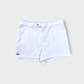 Lacoste shorts in white featuring an embroidered crocodile logo on the lower hem