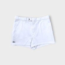 Load image into Gallery viewer, Lacoste shorts in white featuring an embroidered crocodile logo on the lower hem