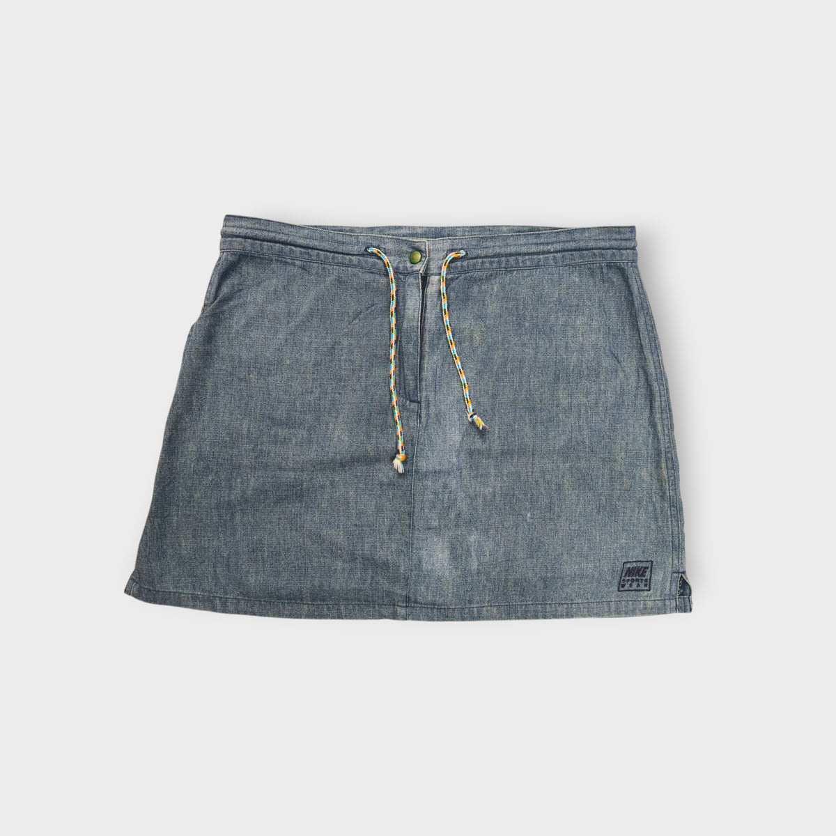 Nike blue denim-look skirt with a patterned drawstring tie and embroidered hem patch