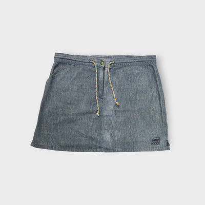Nike blue denim-look skirt with a patterned drawstring tie and embroidered hem patch