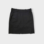 Black Nike Golf skirt with side zip pockets and belt loops visible on a flat lay