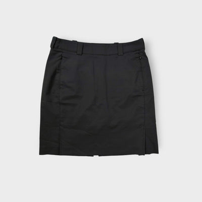 Black Nike Golf skirt with side zip pockets and belt loops visible on a flat lay