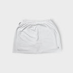 Nike white tennis skirt with elastic waistband and embroidered court logo at hem