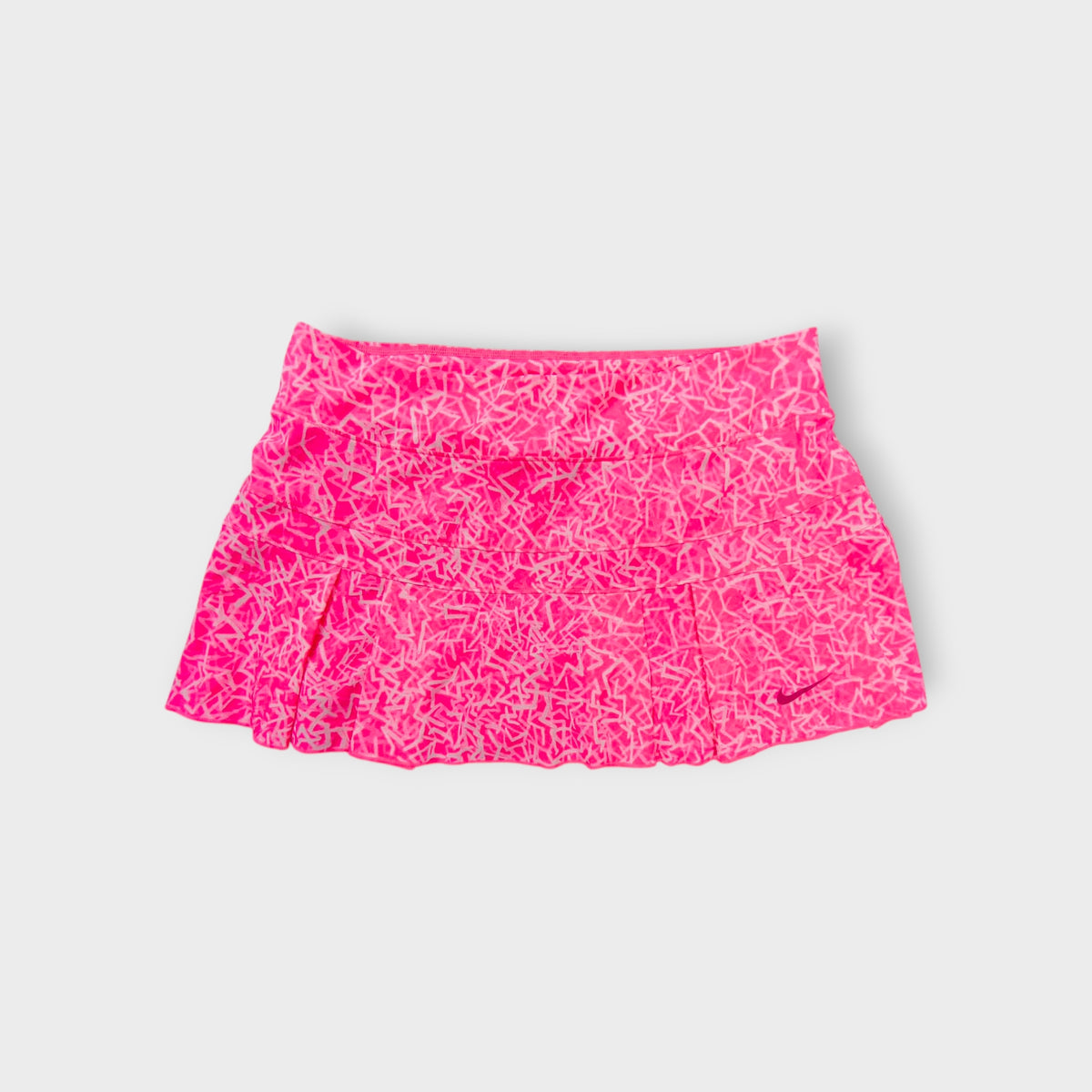 Nike skirt in pink with an abstract geometric print and printed Swoosh logo