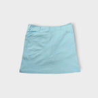 Nike Golf light blue skirt showing embroidered Swoosh logo near the back zip pocket