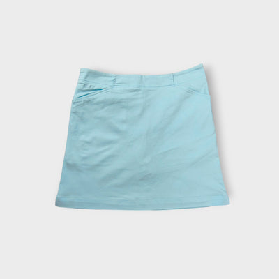 Nike Golf light blue skirt showing embroidered Swoosh logo near the back zip pocket