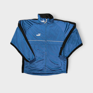 Blue Puma track jacket with black shoulder stripes and embroidered logo, size M