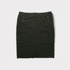 C.P. Company dark grey skirt featuring buttoned pocket details and lace-up back slit