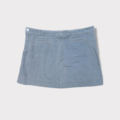 Lacoste corduroy skirt in blue featuring a brown leather waistband logo patch and button.