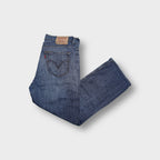 Levi's blue denim jeans featuring back pocket arcuate stitching and leather patch