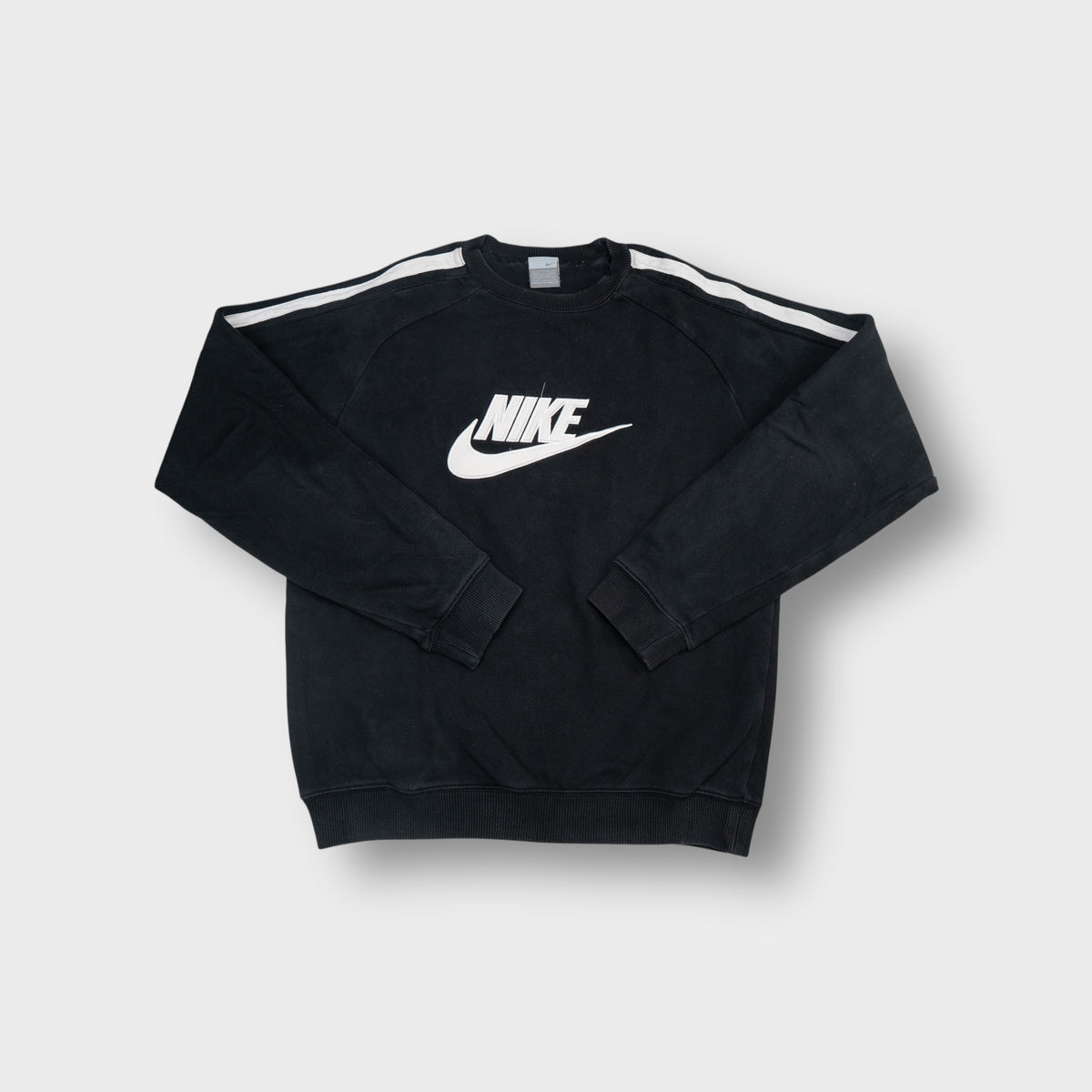 Nike sweater in black featuring a large white chest swoosh and white shoulder stripes