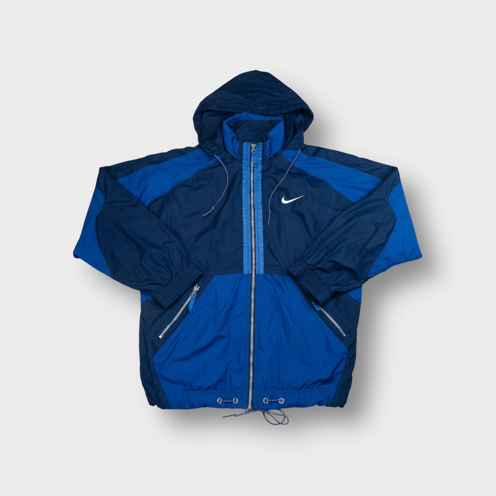 Nike blue hooded track jacket featuring an embroidered white Swoosh on the chest