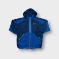 Nike blue hooded track jacket featuring an embroidered white Swoosh on the chest