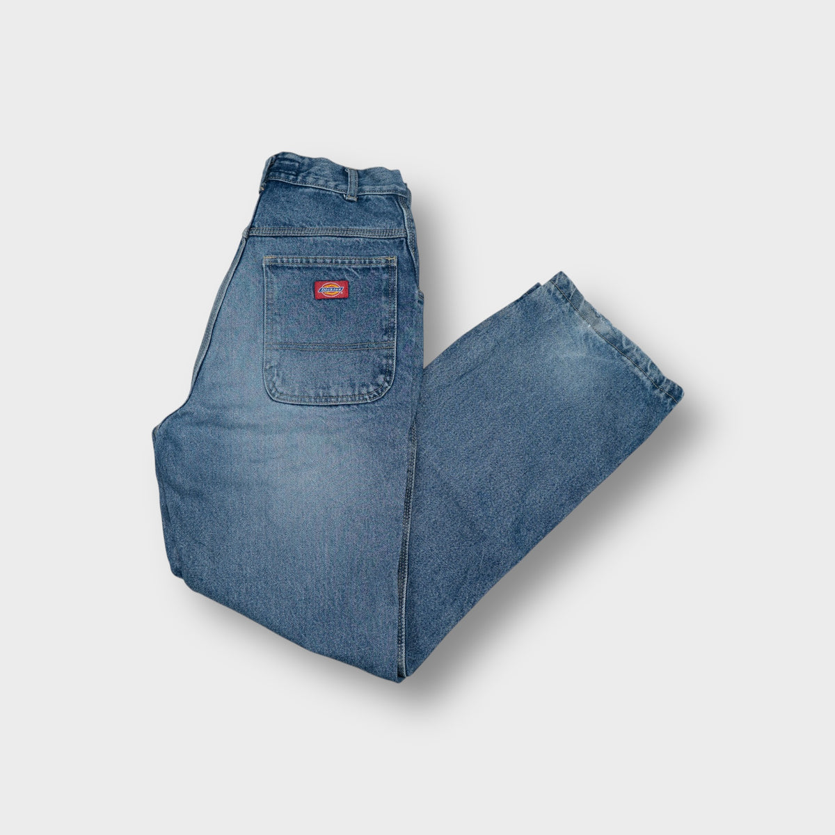 Dickies denim jeans in blue featuring a red woven logo patch on the back pocket